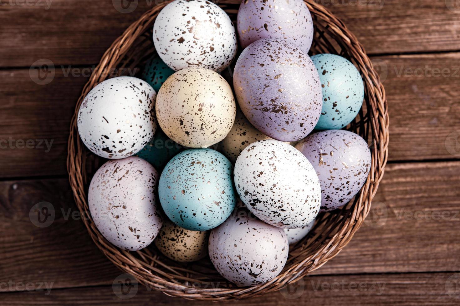 Pastel Easter eggs background. Spring greating card. Easter eggs in basket photo