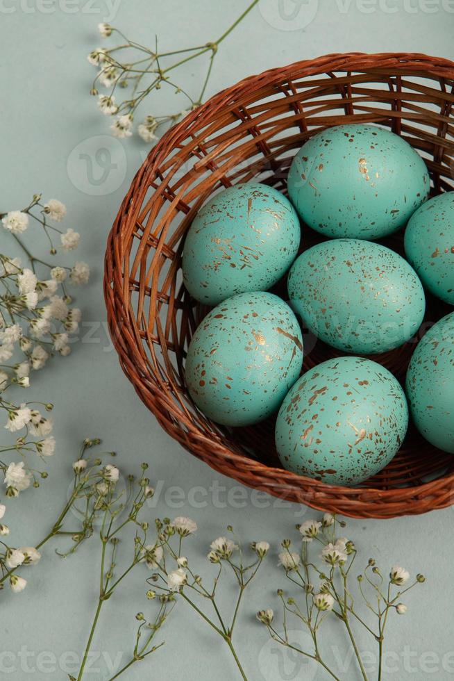 Pastel Easter eggs background. Spring greating card. Easter eggs in basket photo