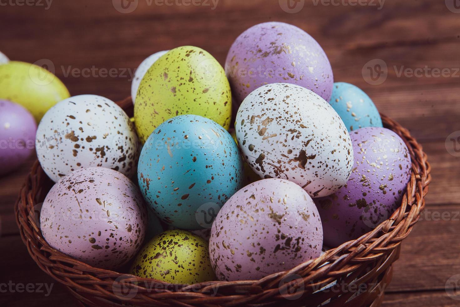 Pastel Easter eggs background. Spring greating card. Easter eggs in basket photo
