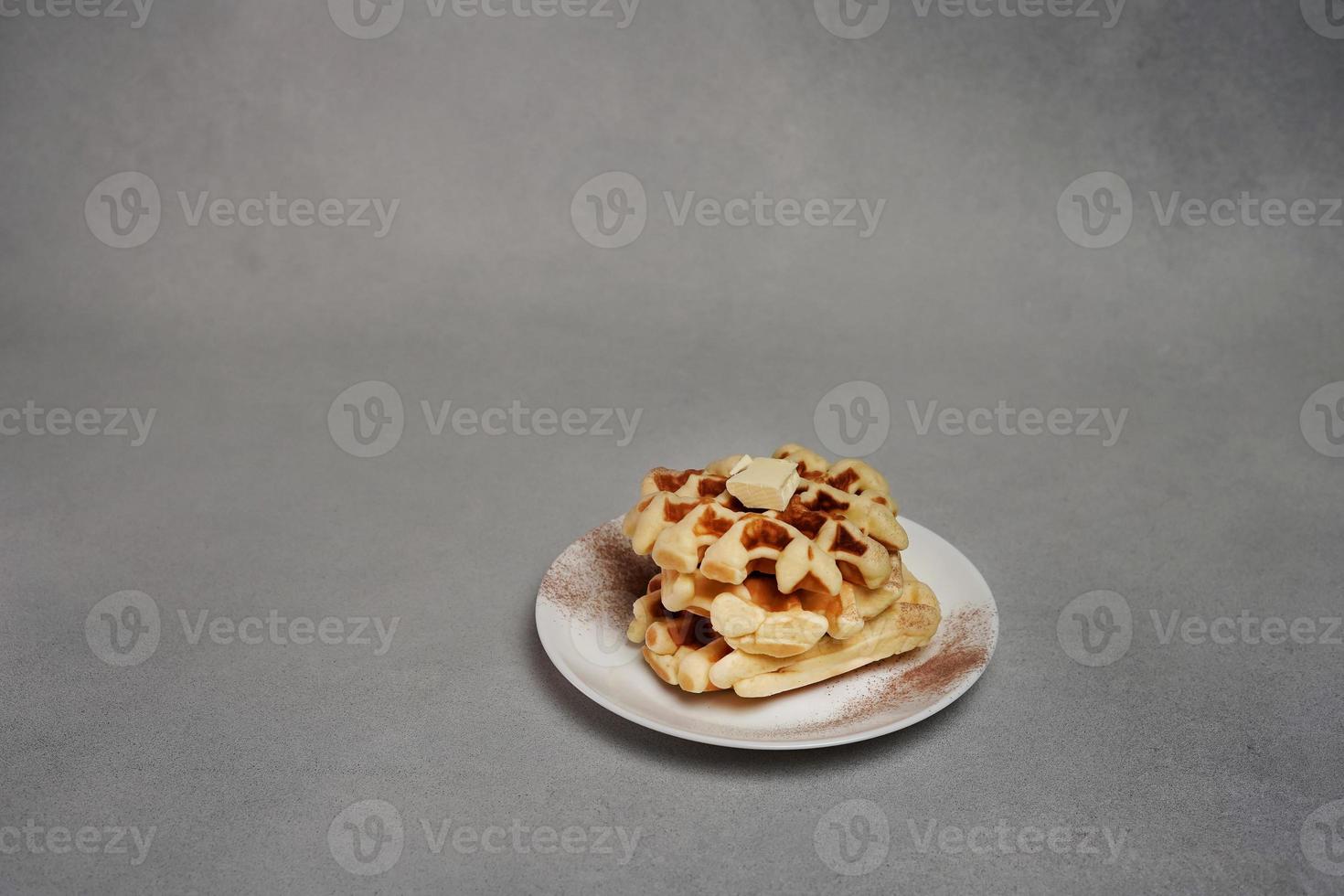 Plate of Homemade Belgian Waffles on Grey concrete Background photo