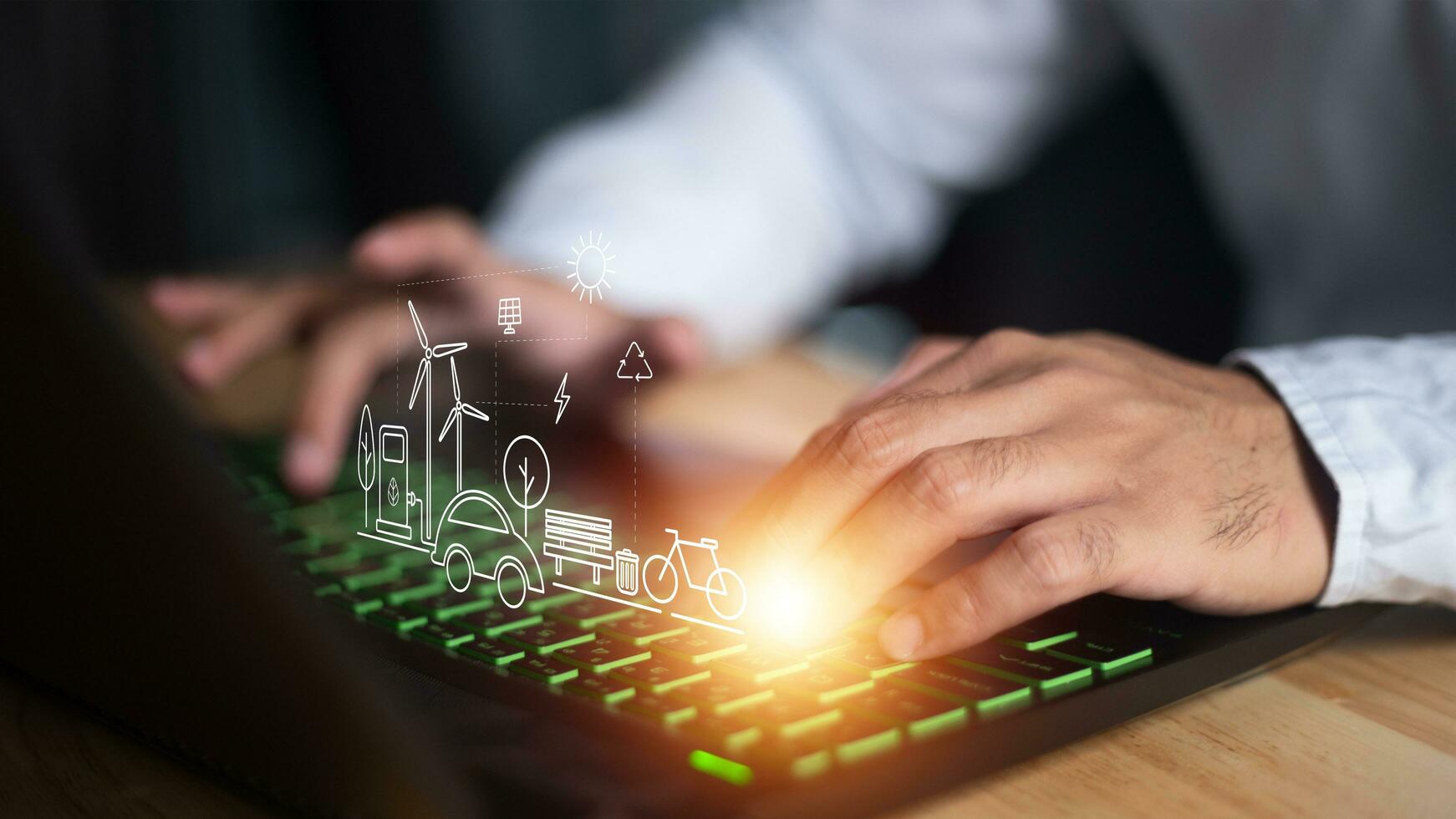 Man using a smart home control system on a laptop with application that controls home electronics in a black background. Smart home concept photo