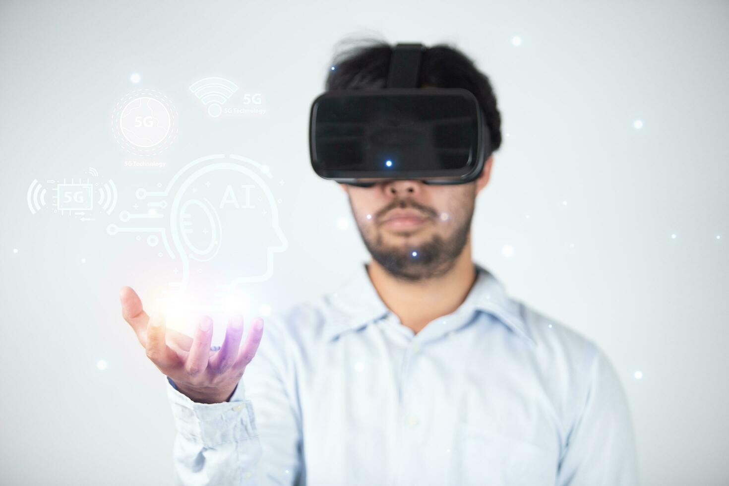 Closeup of bearded young man wearing virtual reality goggles in modern coworking studio. Smartphone using with VR headset. photo