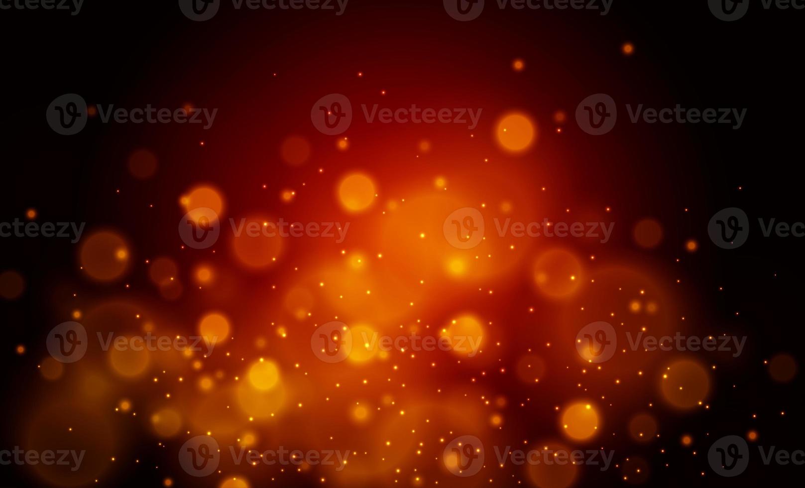 Sparkling dust particles. Glittering red golden dust. Abstract background with bokeh effect. photo