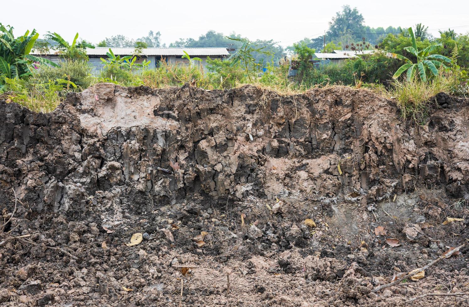 Background view of the soil wall under a paved road that has been dug for renovation. photo