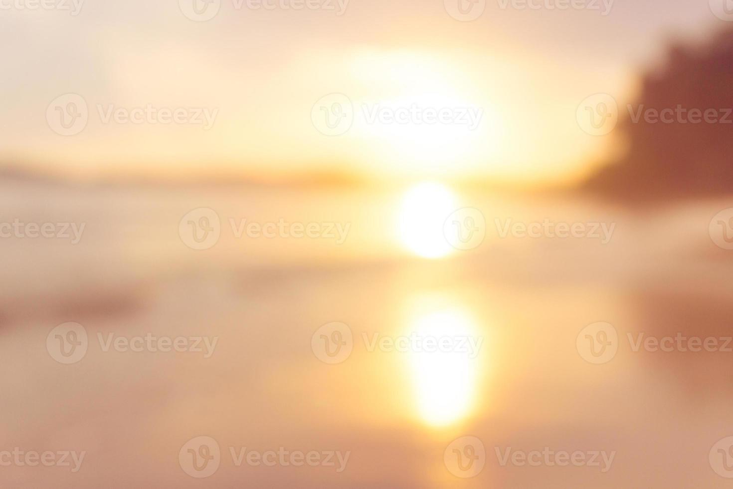 beach at sunset blur background photo