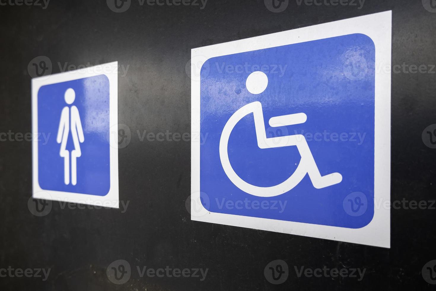 Disabled sign in a toilet photo