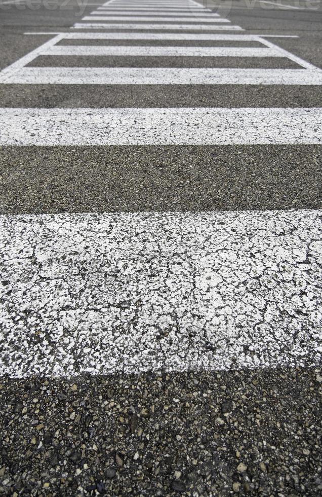 Old pedestrian crossing on the asphalt photo