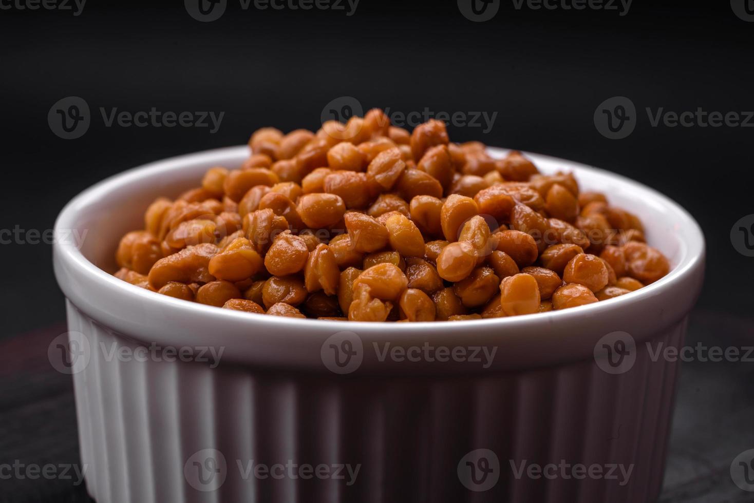 Delicious healthy canned lentils in a ceramic ribbed white bowl photo