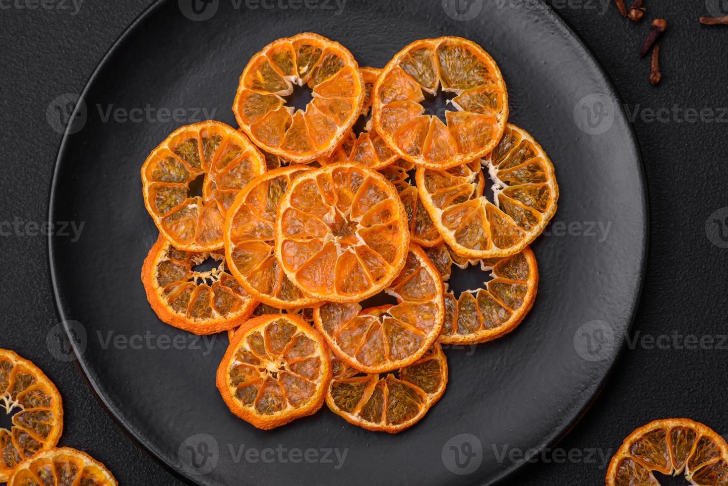 Dried round shape slices of bright orange color tangerine photo