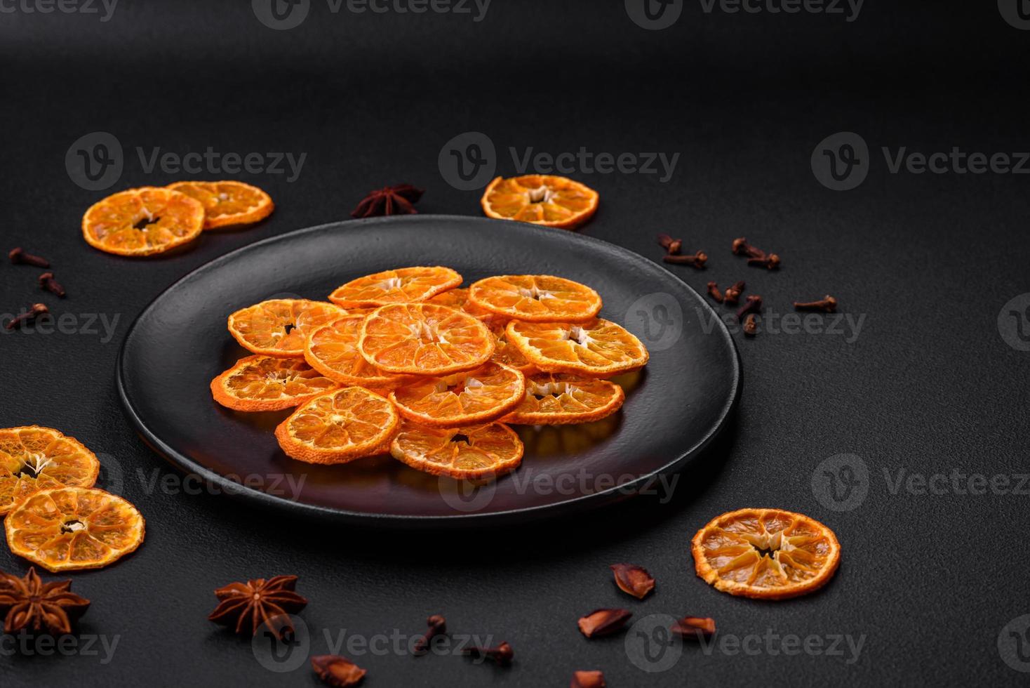 Dried round shape slices of bright orange color tangerine photo