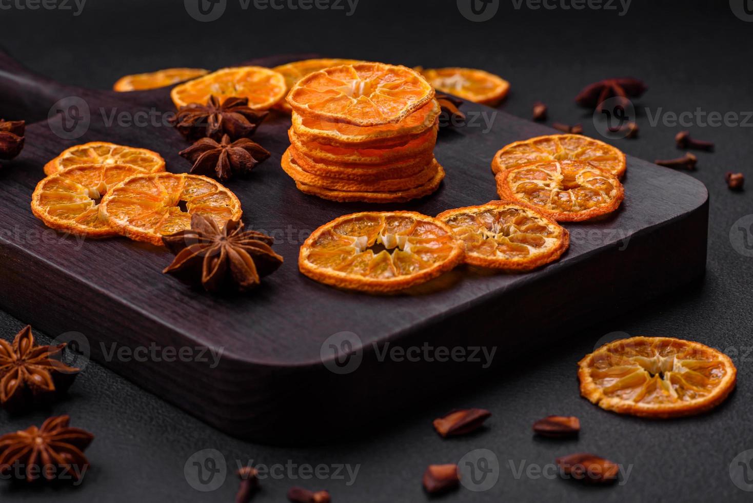 Dried round shape slices of bright orange color tangerine photo