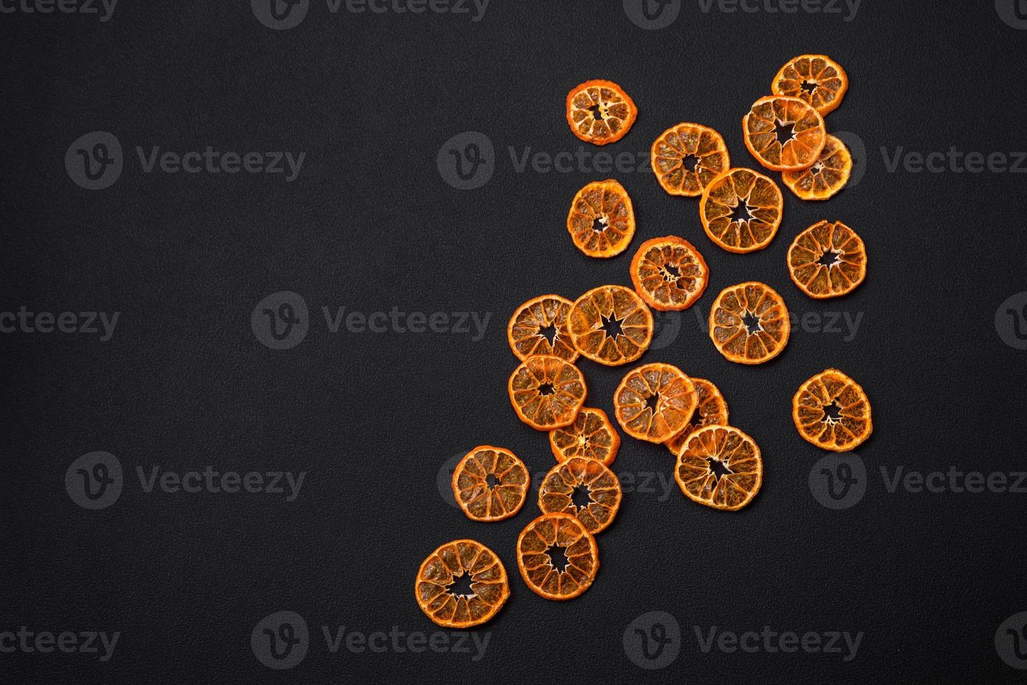 Dried round shape slices of bright orange color tangerine photo