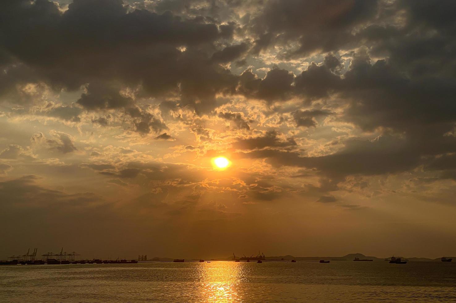 Sky sunset at beach scenery, Whether it's the warm hues of a sunrise or sunset, shimmering reflection of the sun on the clouds, the sky and clouds have the power to inspire feelings of awe and wonder photo