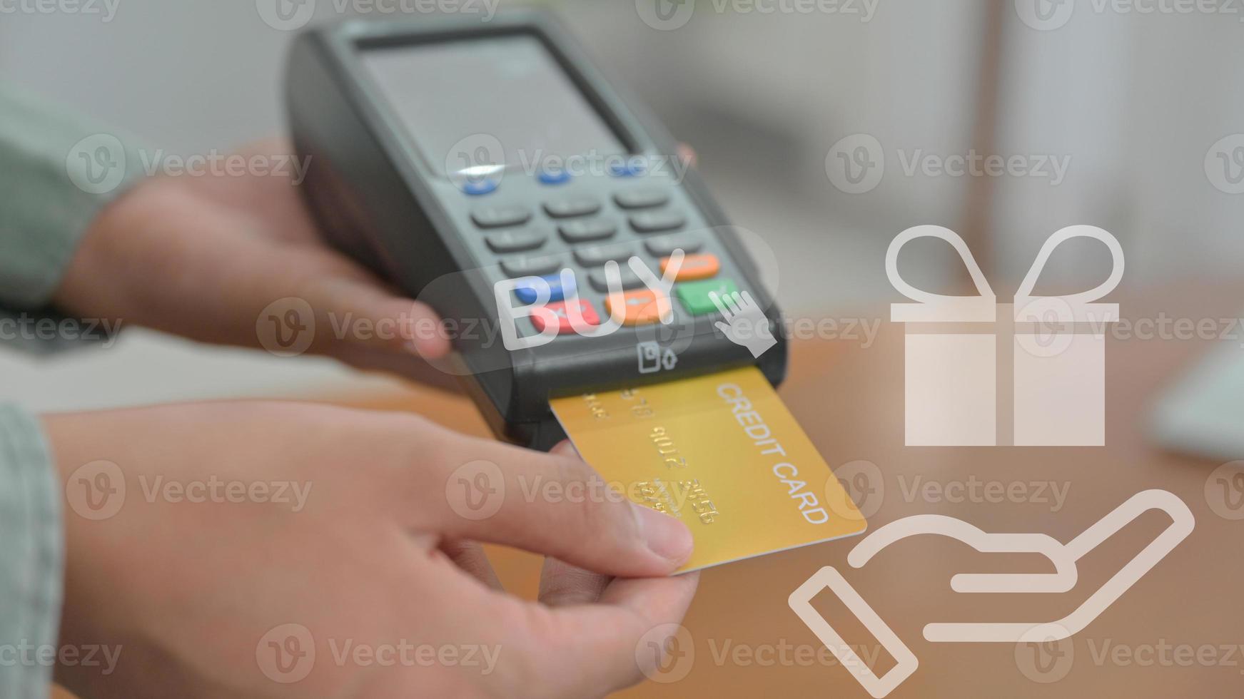 Close - up shot of Employees accept credit card payments via EDC. photo