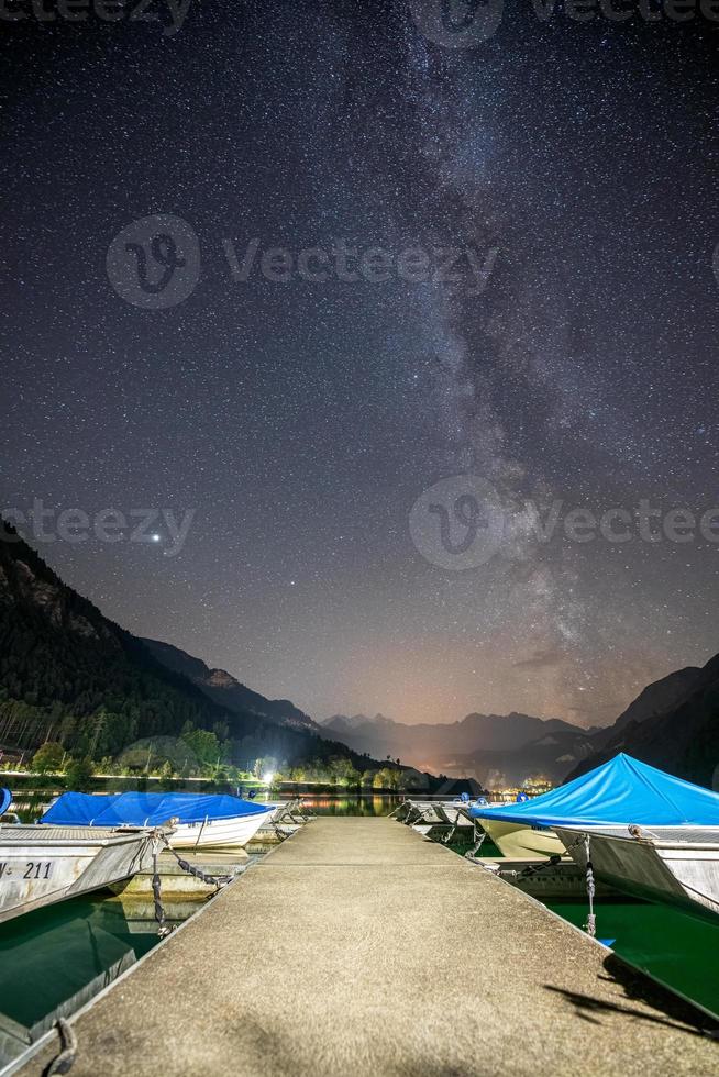 A jetty at night, the milk route can be seen in the sky photo