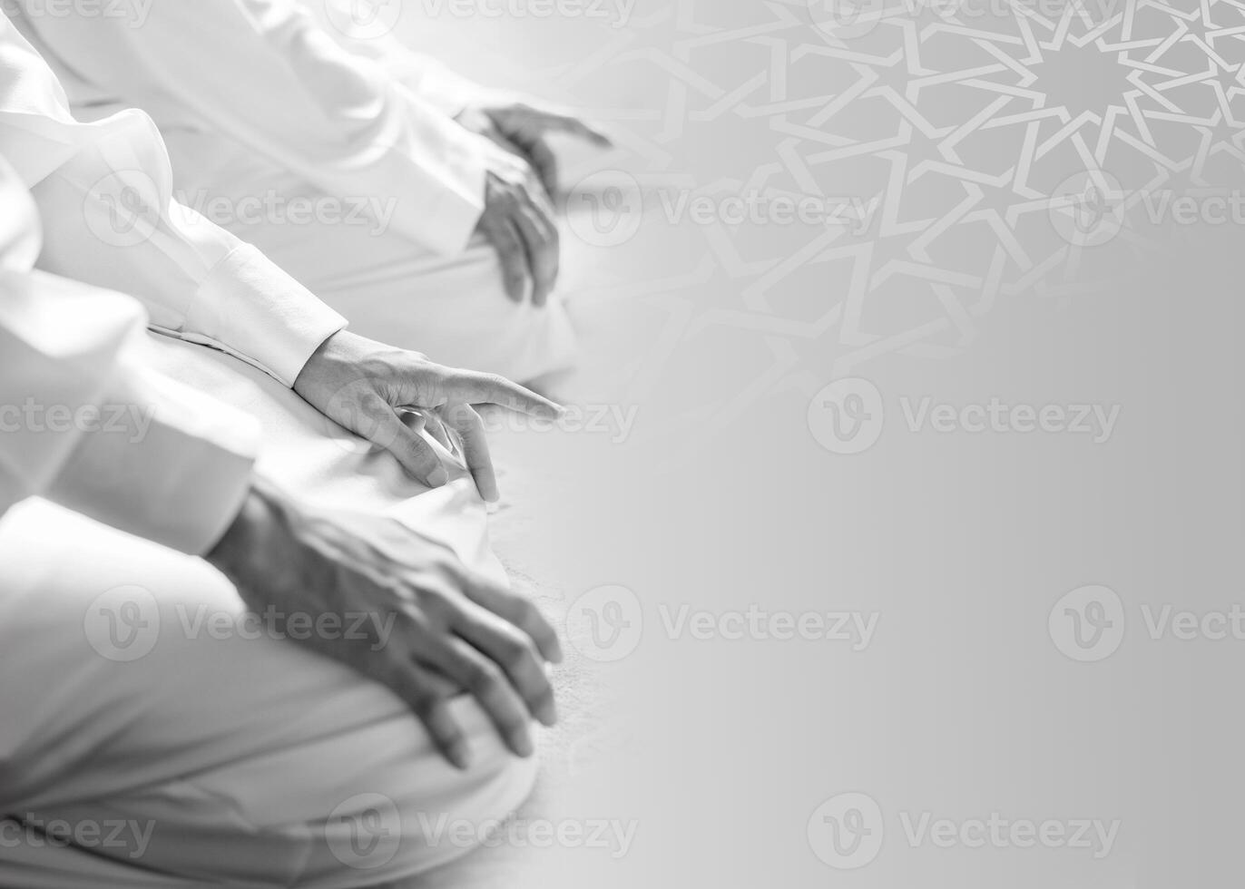 A man sits on a prayer mat with the text al adha on the right islamic ramadan kareem greeting photo