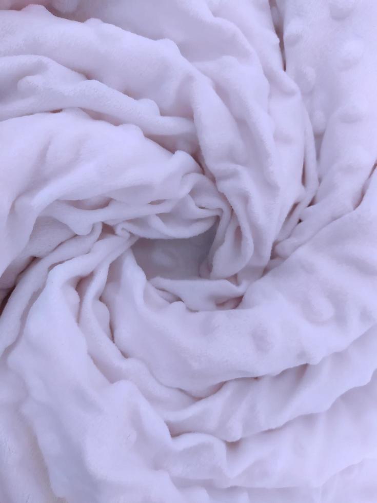 Macro shot of a soft white blanket. photo