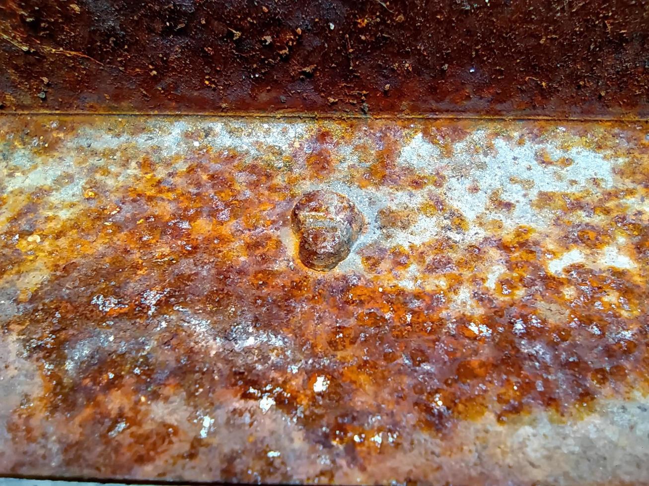 Macro of rusty texture on old aluminum sheet. photo