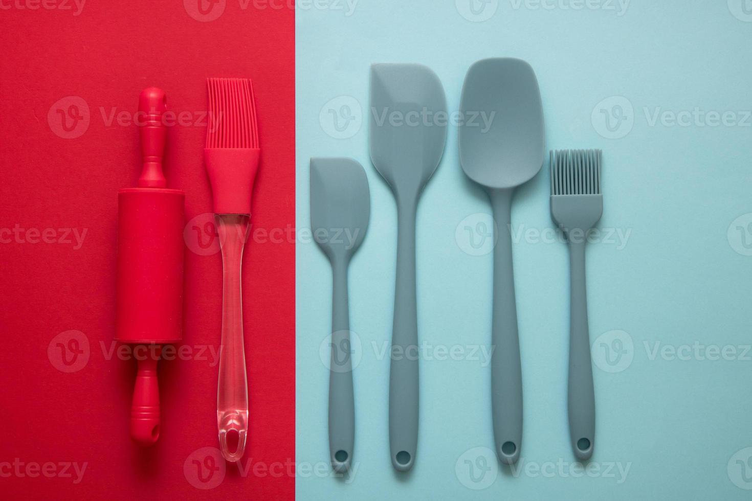 culinary accessories spatula, brush, rolling pin for text on red and blue background, culinary background photo