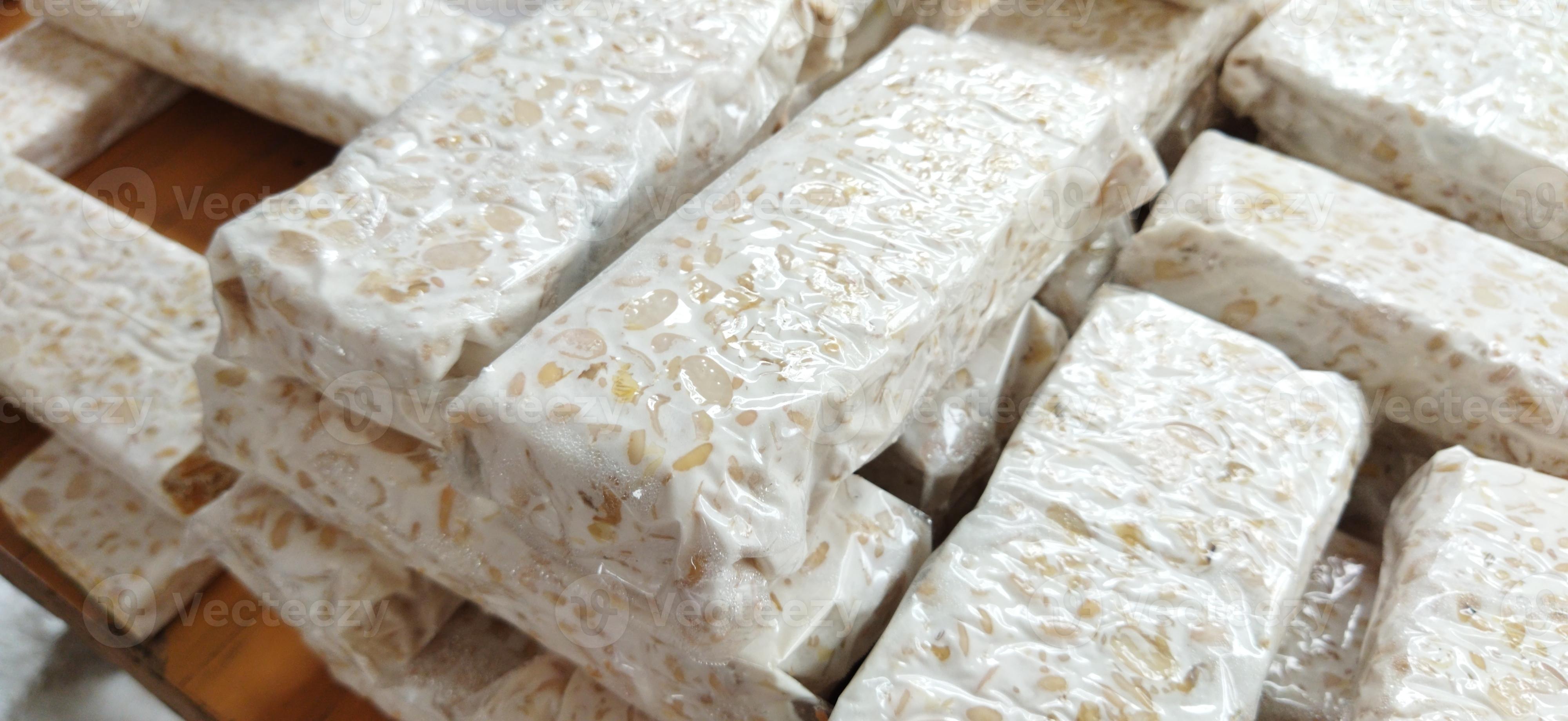 tempe mentah. raw tempeh, uncooked soybean cake from indonesia in a