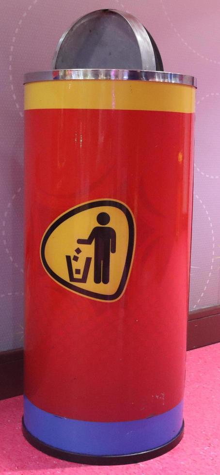 Red Metal dustbin in Funland. trash can. photo