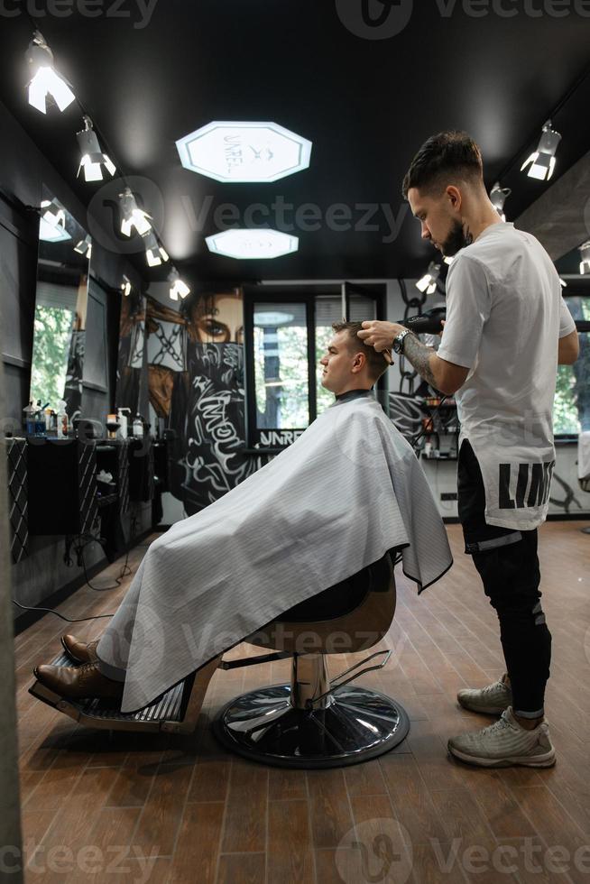 groom in the barber shop photo