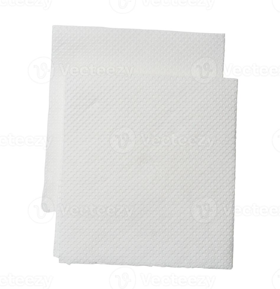 Two folded pieces of white tissue paper or napkin in stack isolated on white background with clipping path photo
