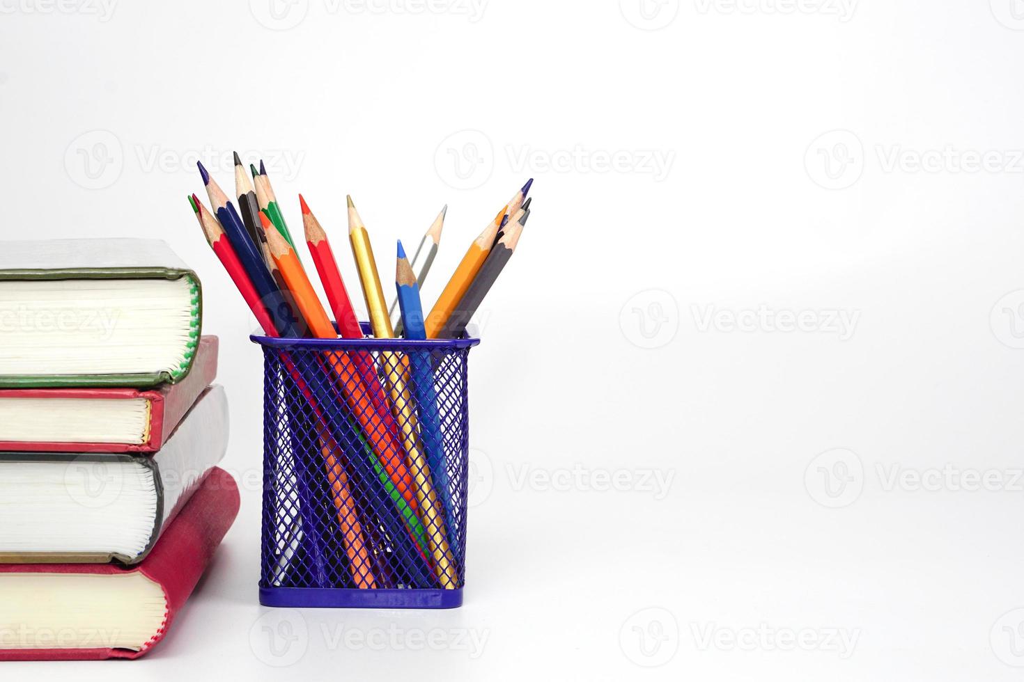 Stack of books and blur pencil on white background. Knowledge and education concept. photo