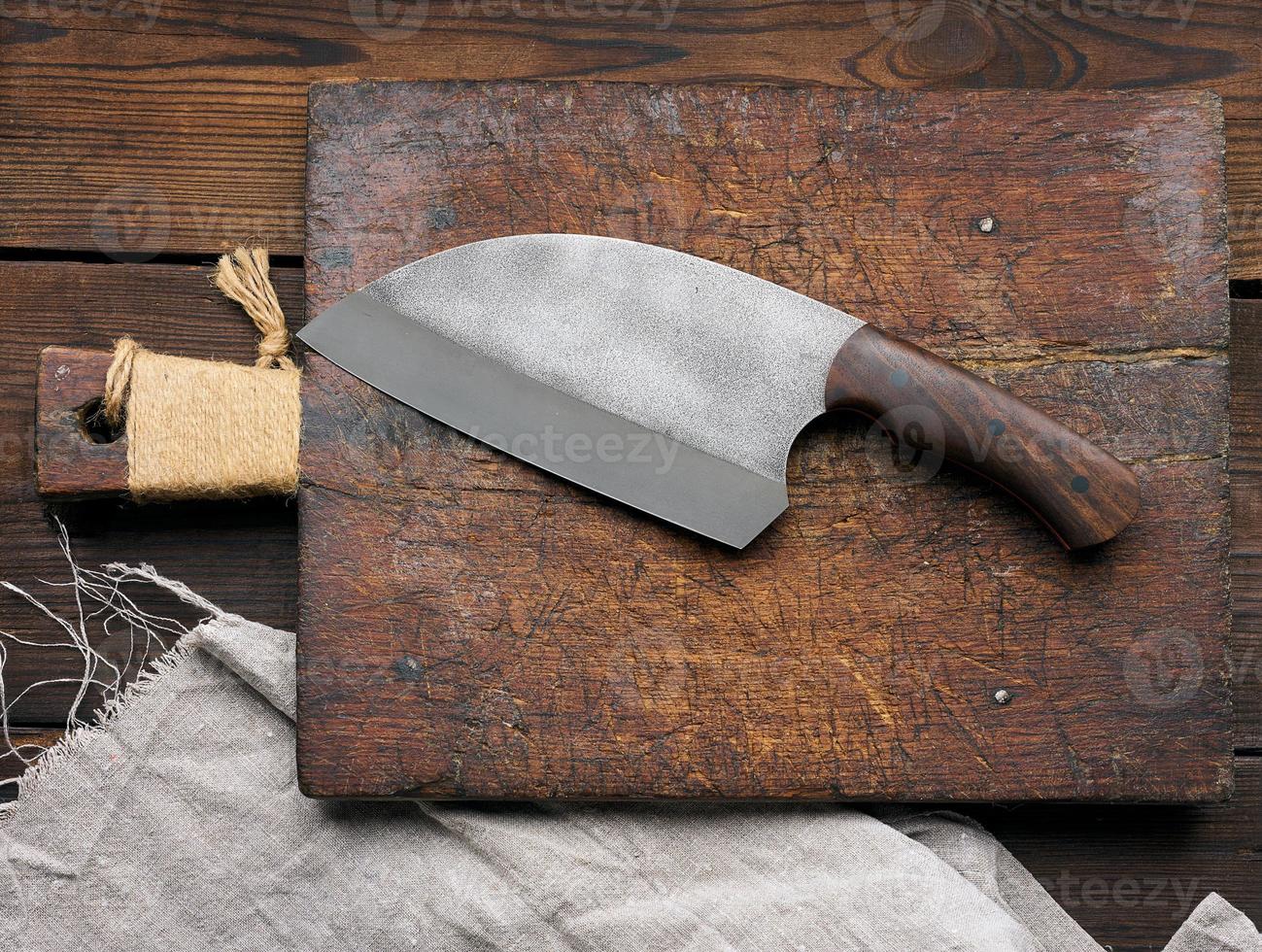 Wooden cutting board and knife photo