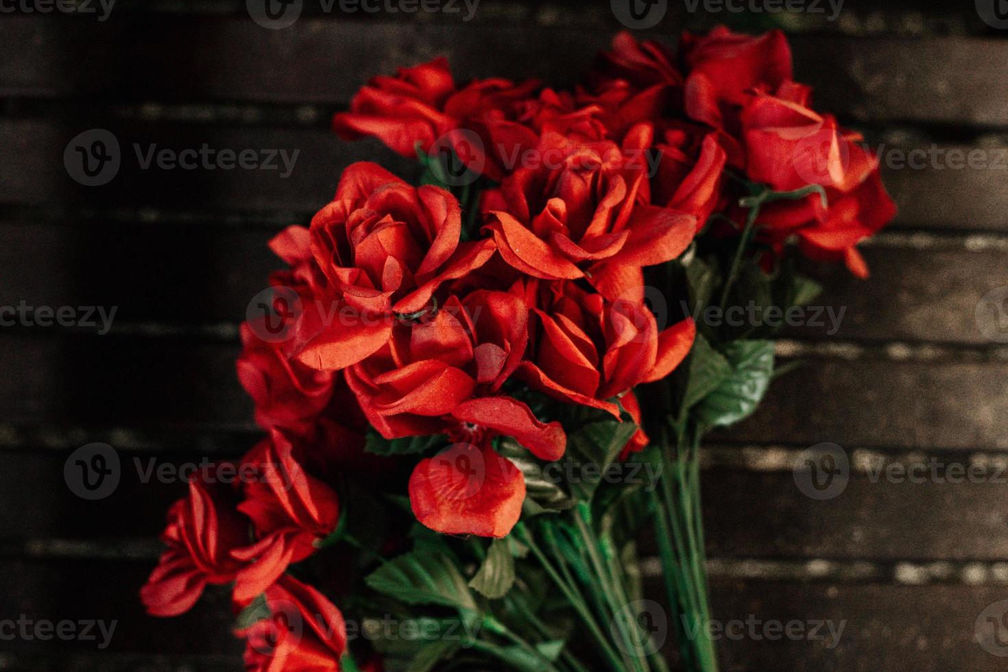 roses on a wooden surface photo