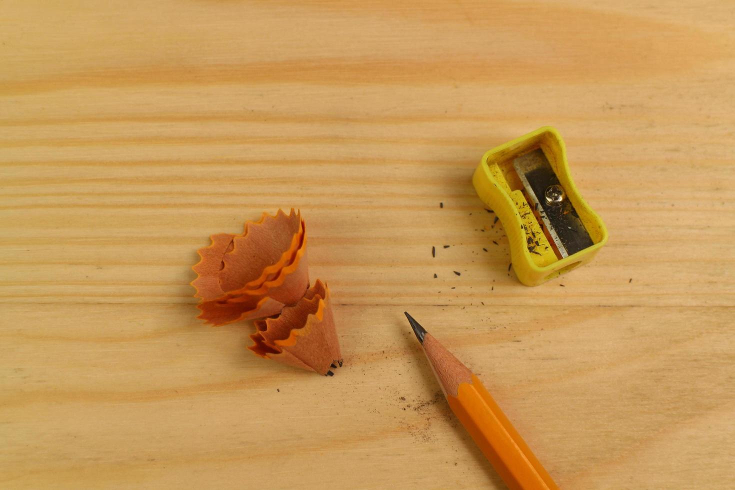 Pencil Sharpener on Wooden Background photo