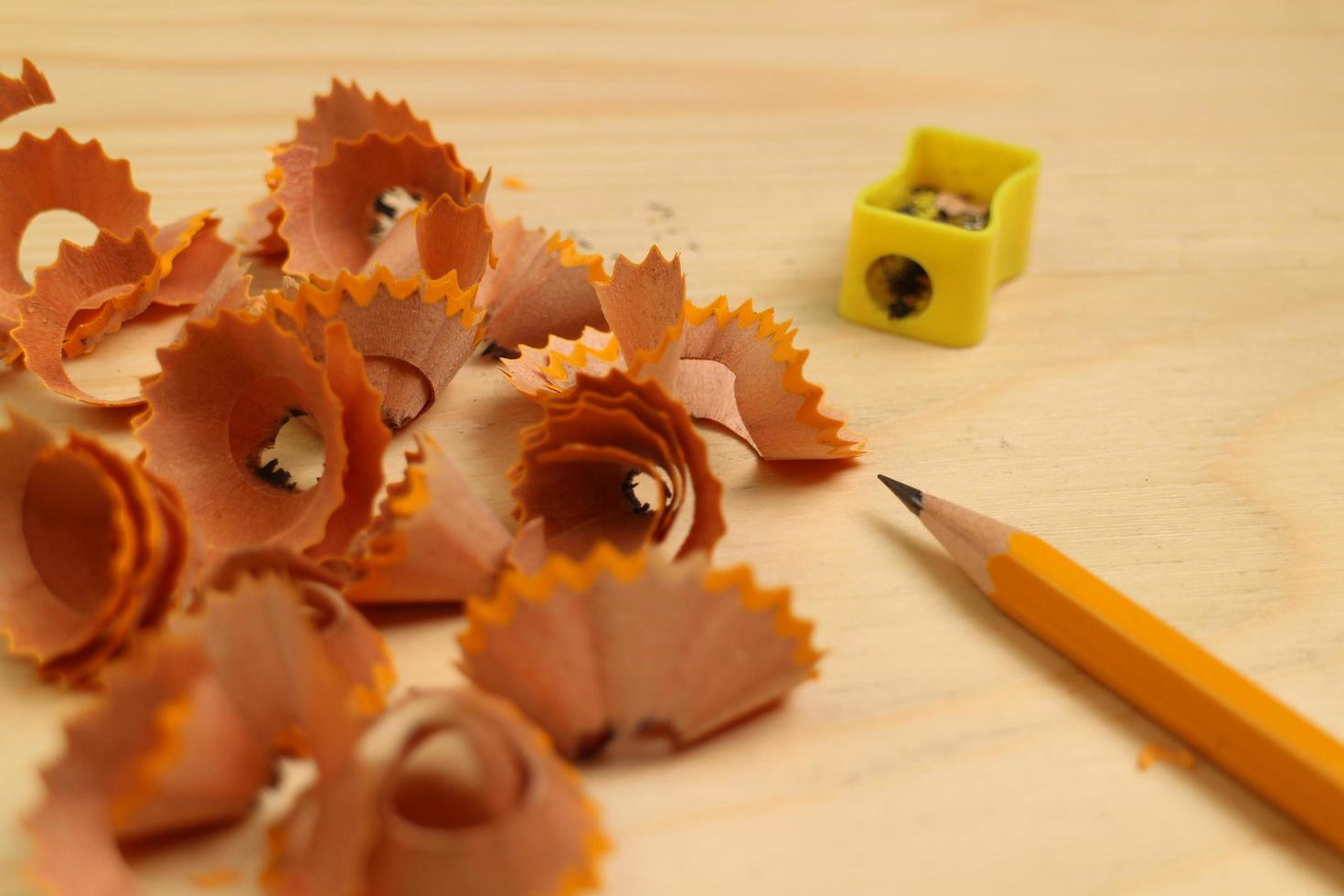 Pencil Sharpener on Wooden Background photo