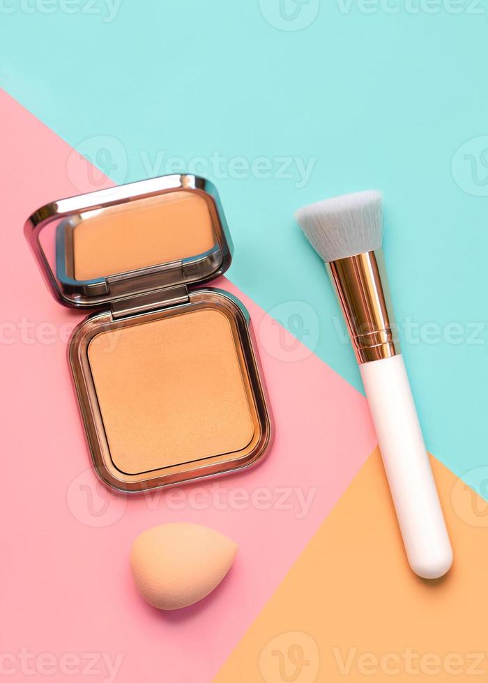 Makeup buffer brush with face powder and beauty makeup sponge. Beauty and makeup concept photo