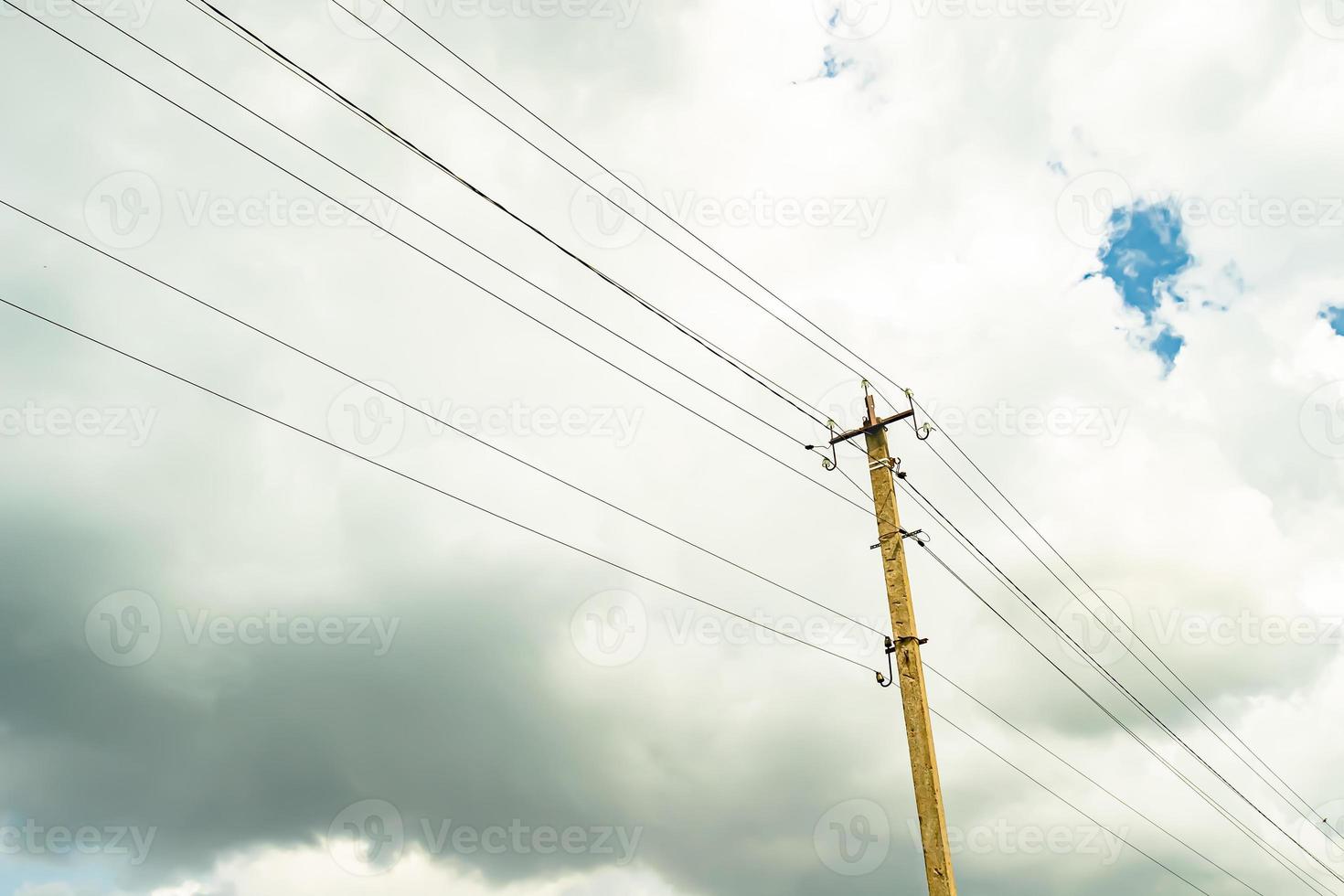 Power electric pole with line wire on colored background close up photo