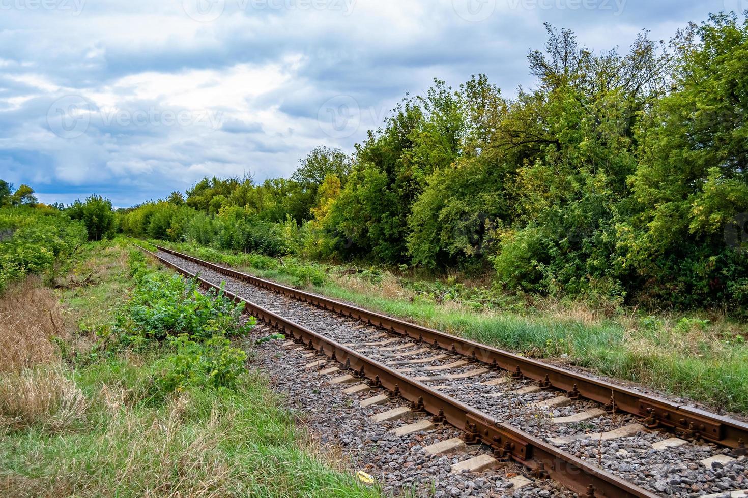 Photography to theme railway track after passing train on railroad photo