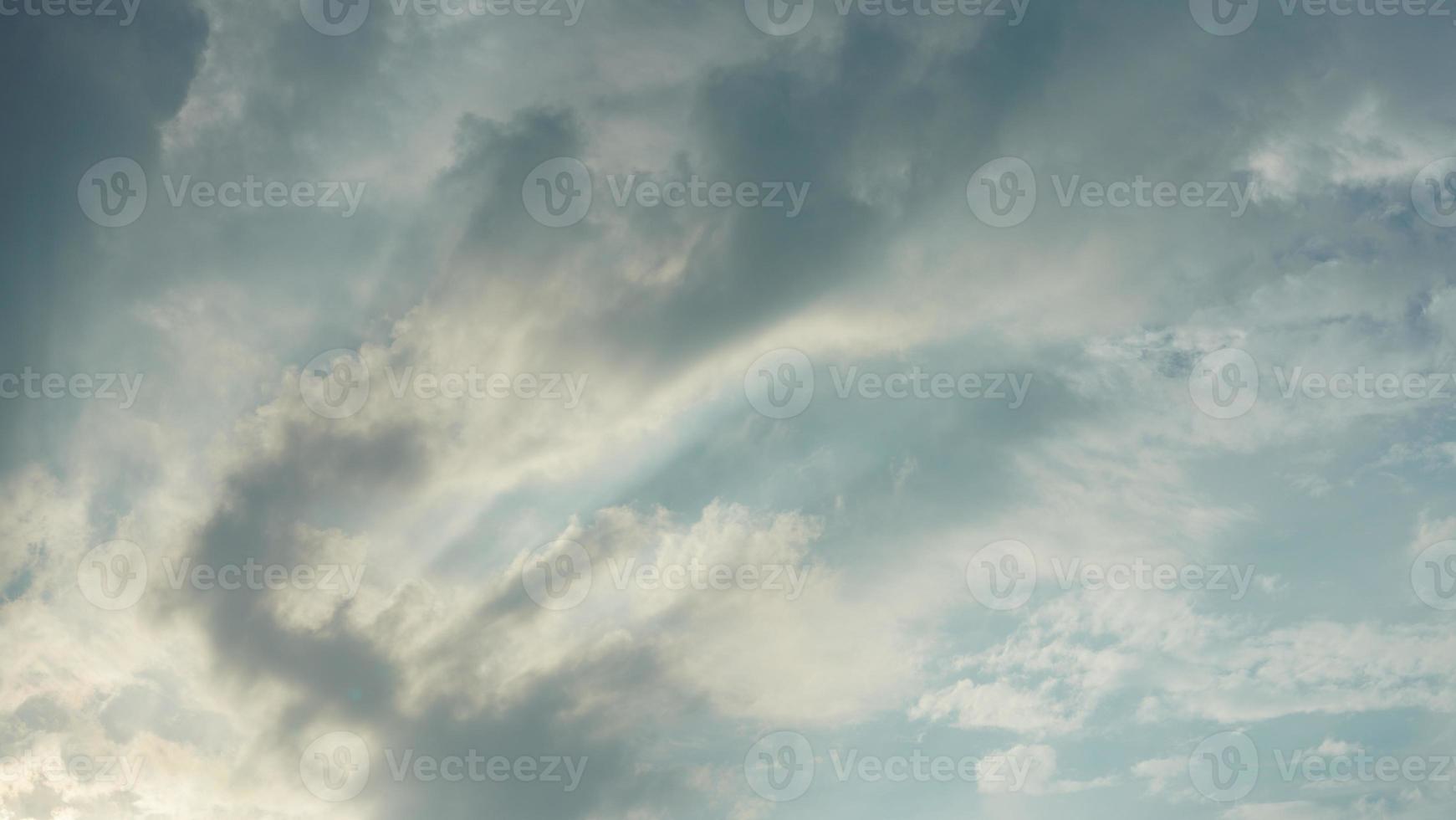 The beautiful sunset sky view with the colorful clouds and warm lights in the sky photo