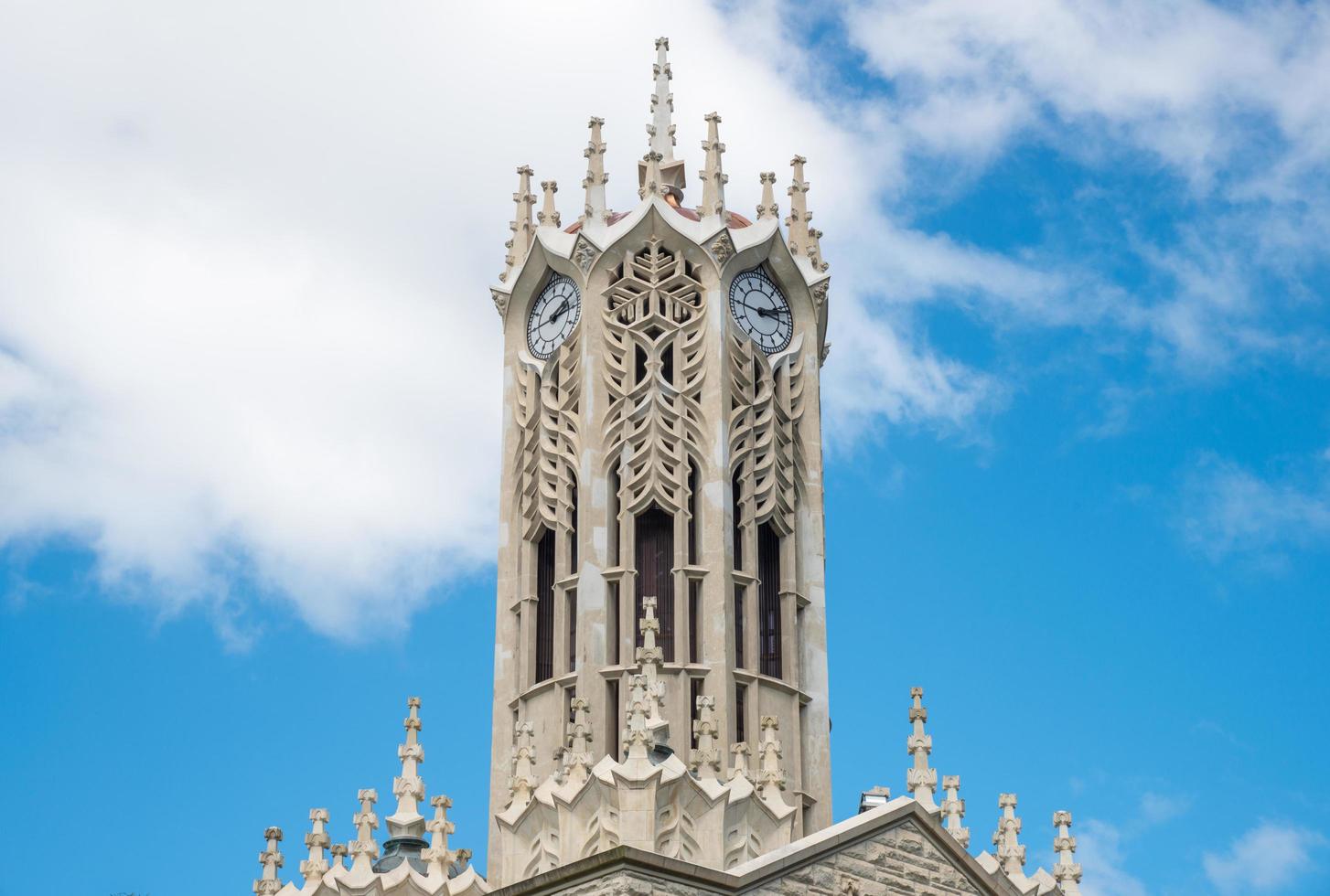 The clock tower of an Old arts building in the University of Auckland is the largest university in New Zealand. photo