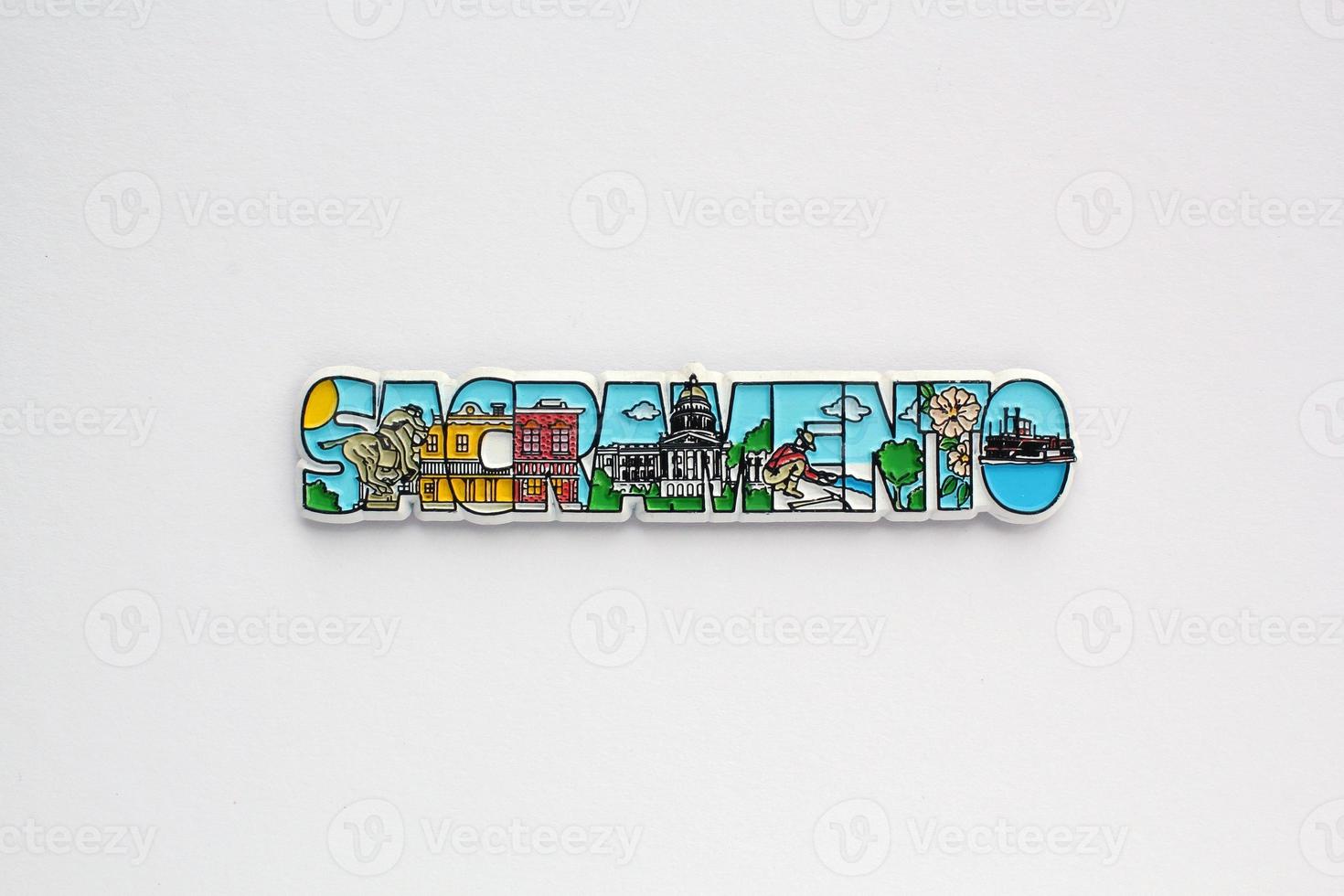 Colourful PVC souvenir fridge magnet of Sacramento, USA on white background. Travel memory concept. Gift typical product for tourists from foreign trip. Home decoration. Top view, flat lay, close up photo