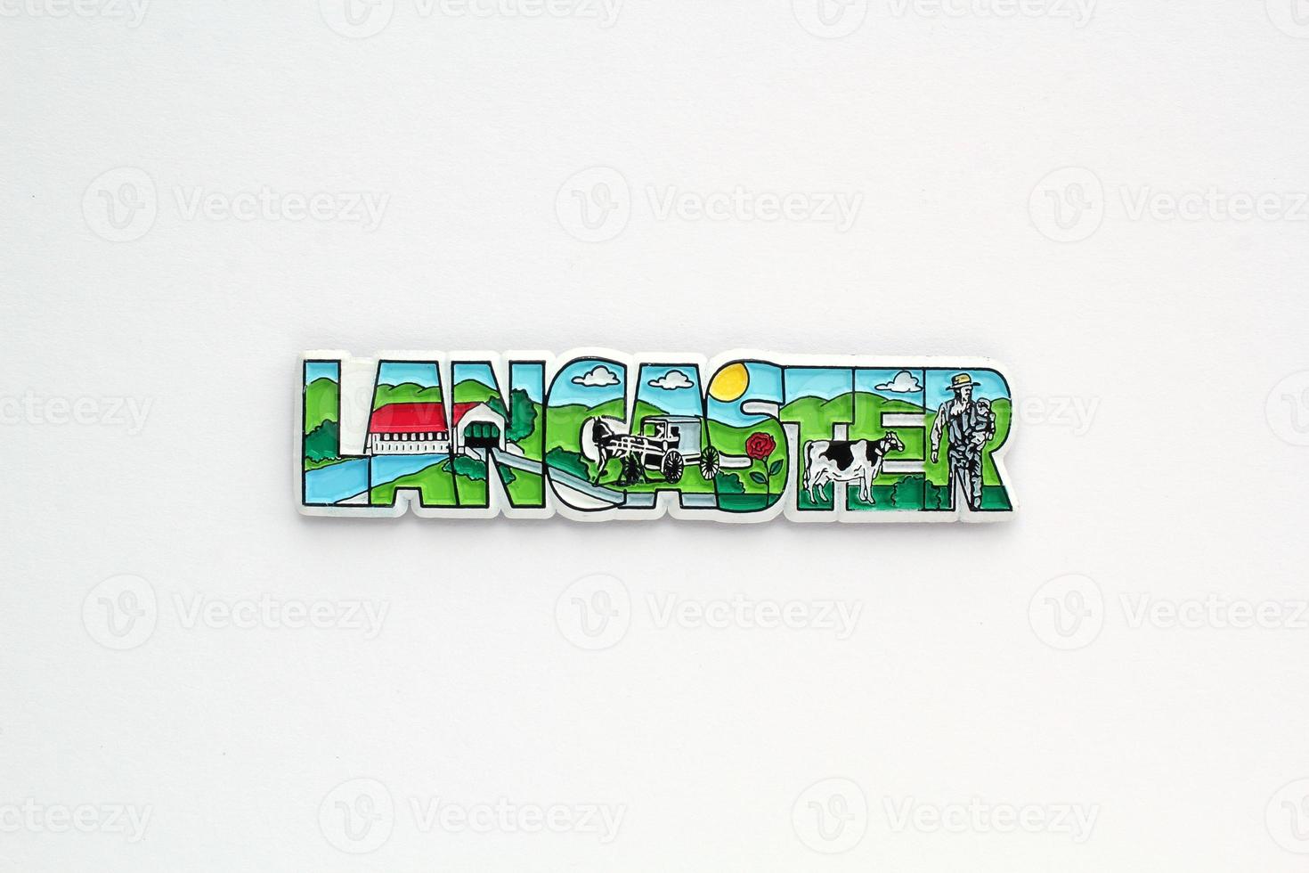 Colourful PVC souvenir fridge magnet of Lancaster, USA on white background. Travel memory concept. Gift typical product for tourists from foreign trip. Home decoration. Top view, flat lay, close up photo