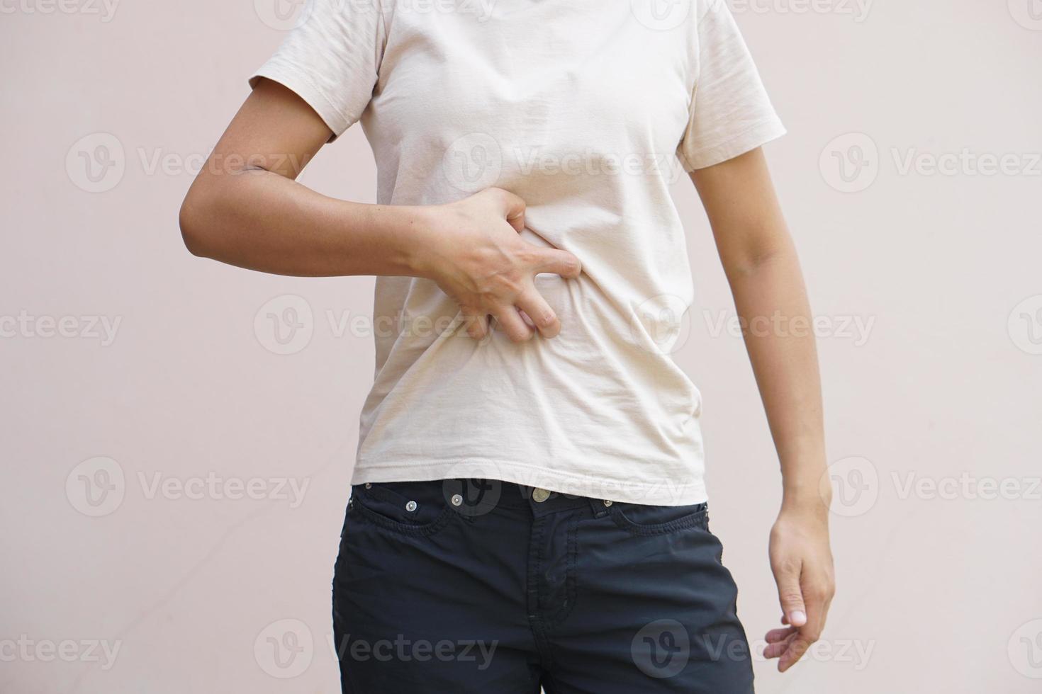 Asian woman having waist itching photo