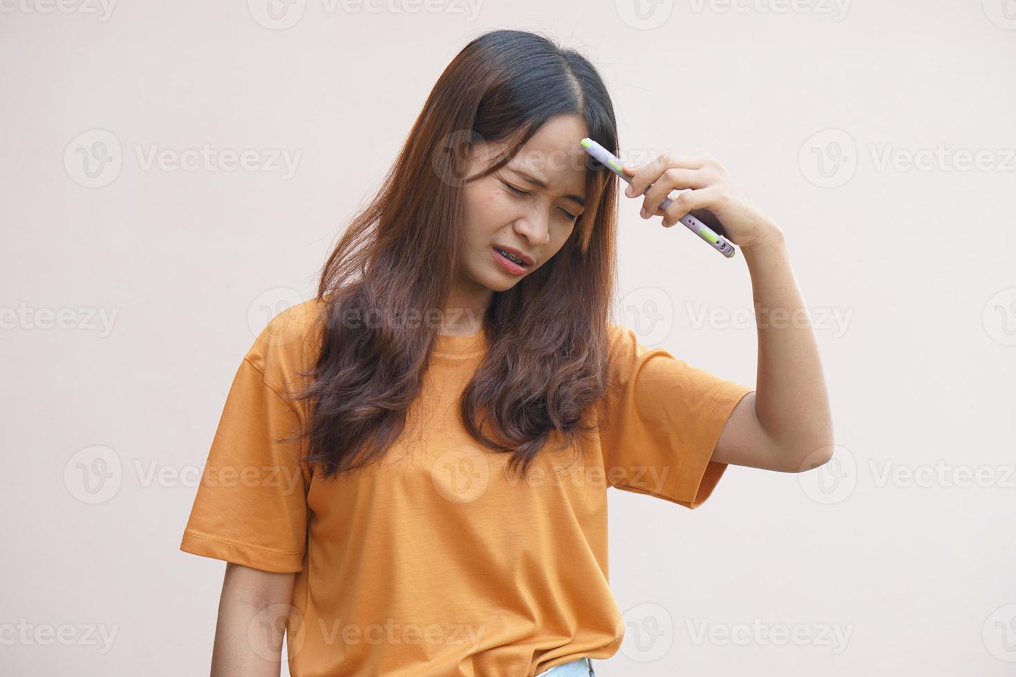 Asian woman Stressed out when being scammed in online purchases photo