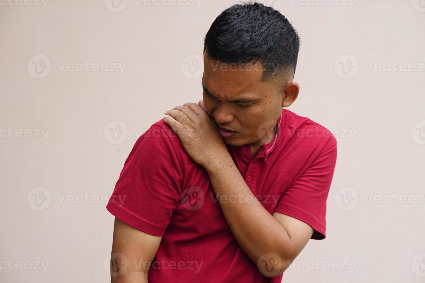 Asian man with shoulder pain photo