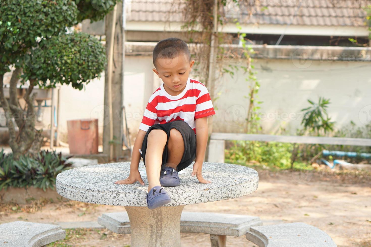 boy playing on the table photo