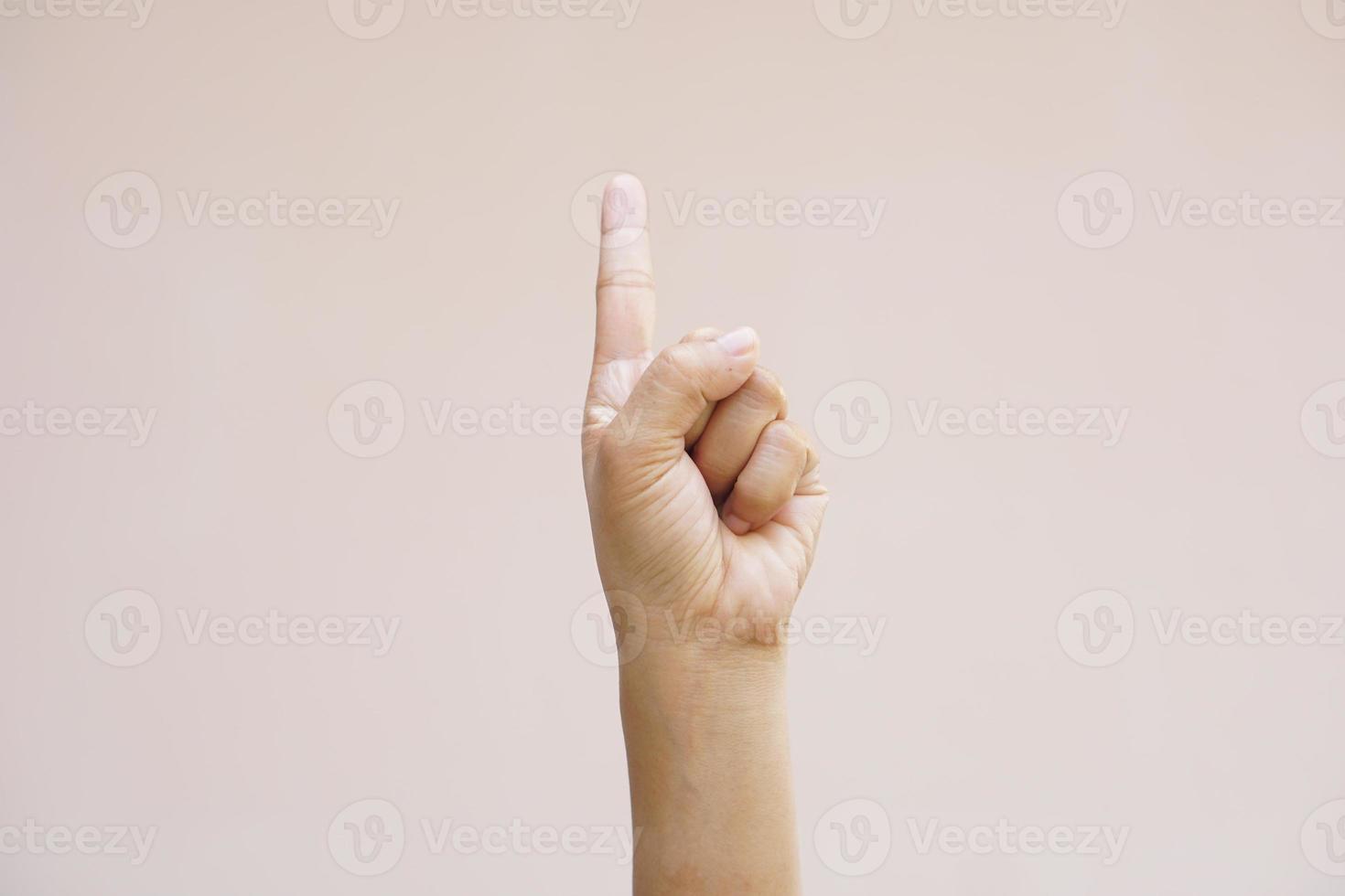 Asian woman making hands like pressing a button photo