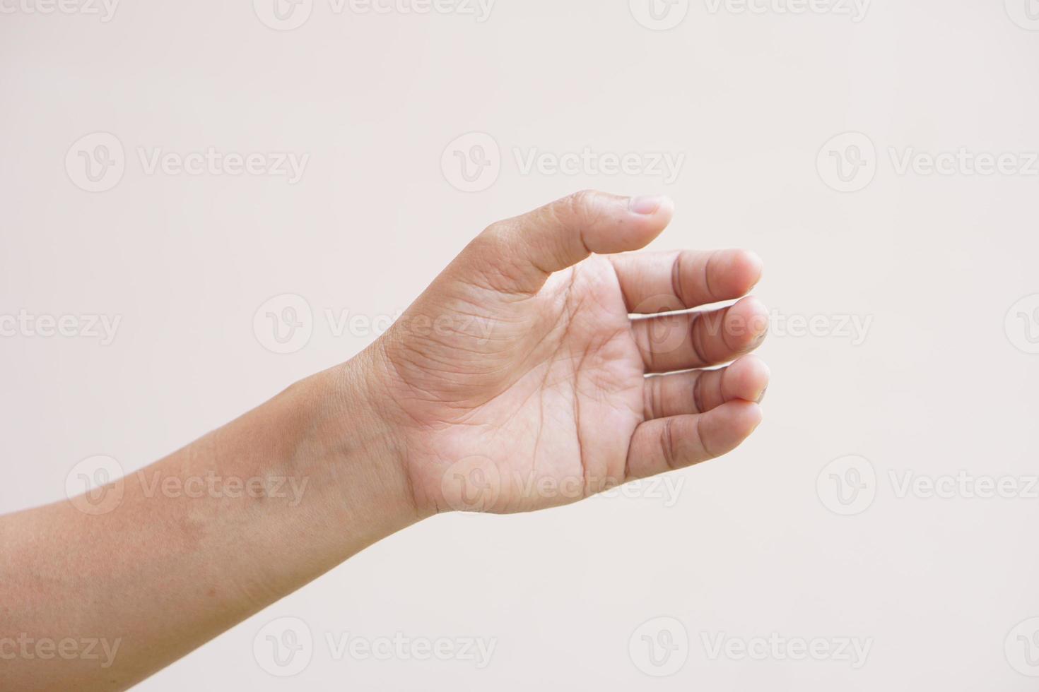 Asian woman making hands like holding an empty bottle photo