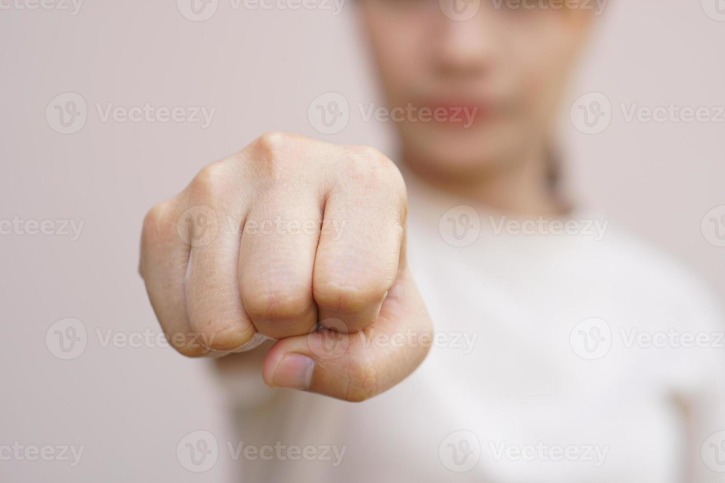 Asian woman clenching her fist photo