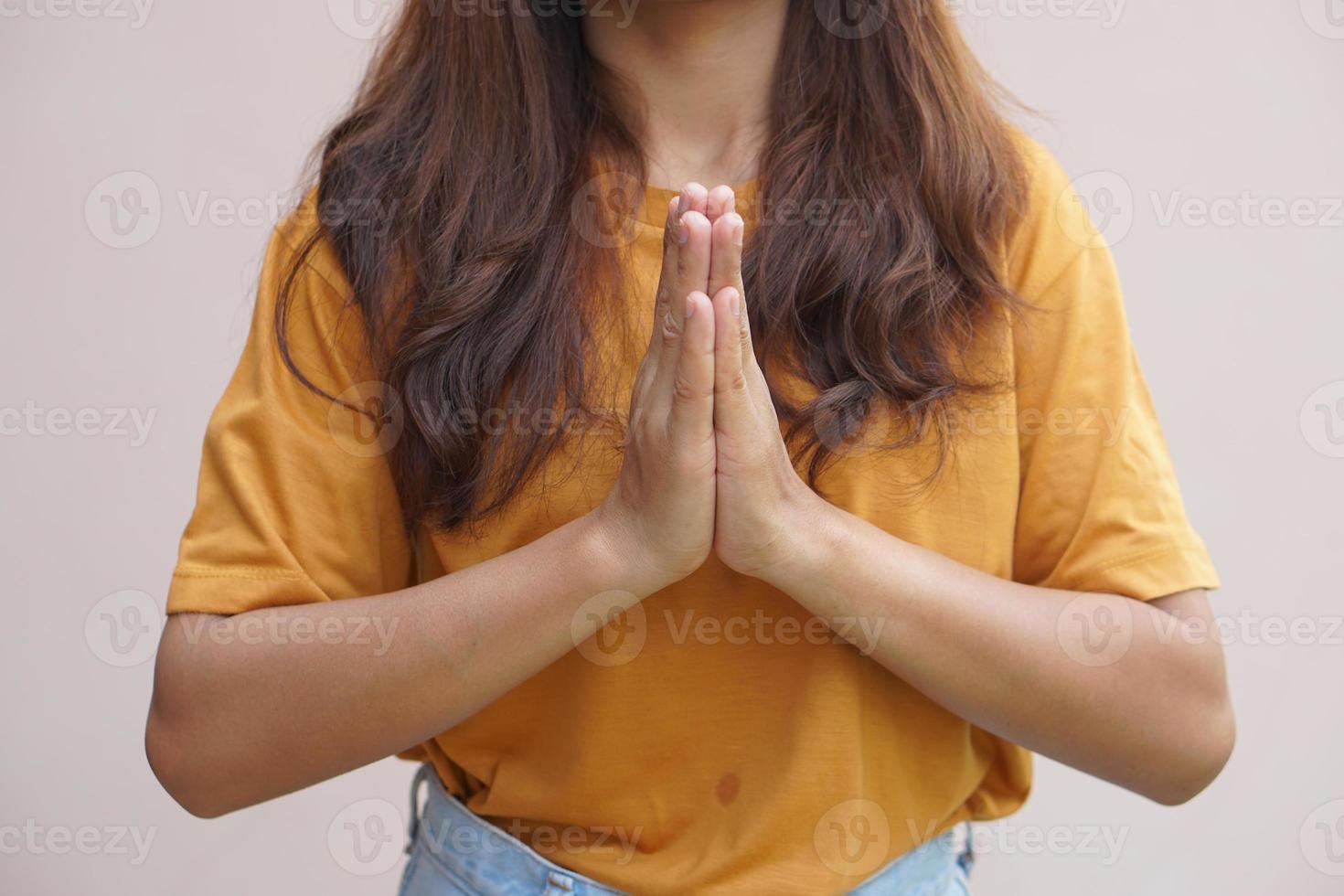 Asian woman making a wish from the holy things photo
