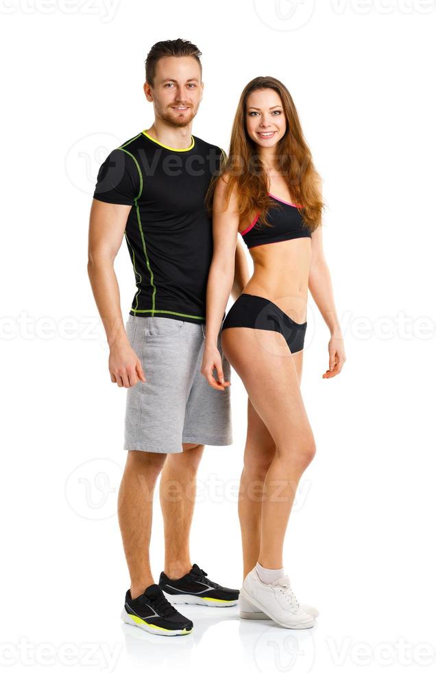 Athletic man and woman after fitness exercise on the white photo