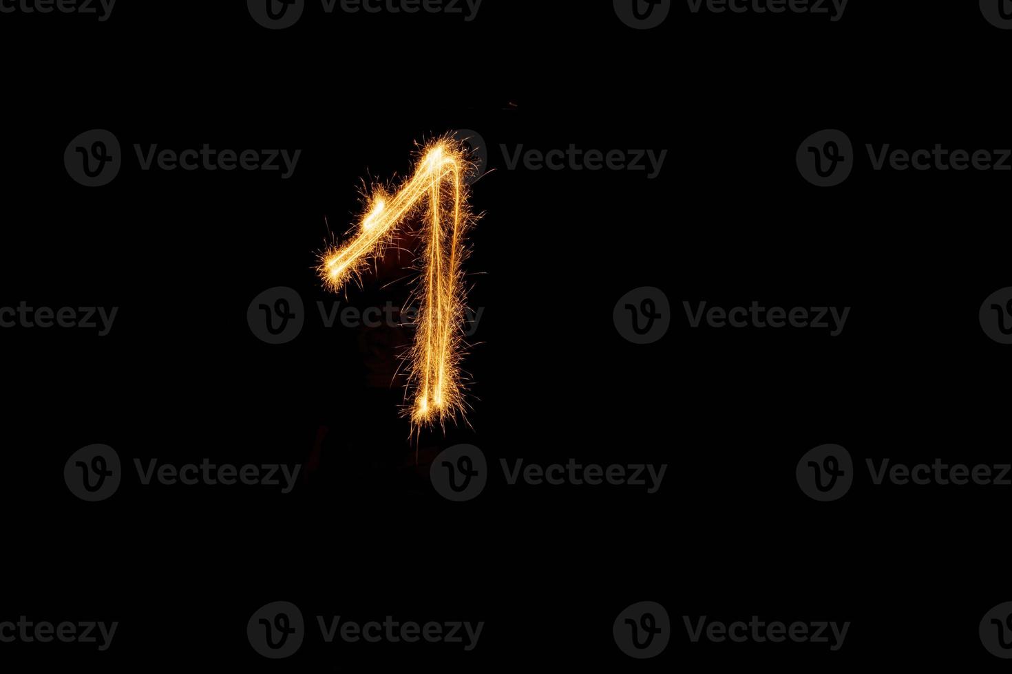 Number made with sparklers ready for your inscriptions on black background photo