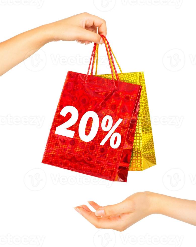 Woman's hands with shopping bags photo